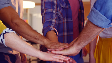 business colleagues forming hand stack