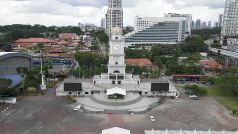 dolly shot from an aerial drone of jam besar dataran in johor bahru clock tower in malaysia