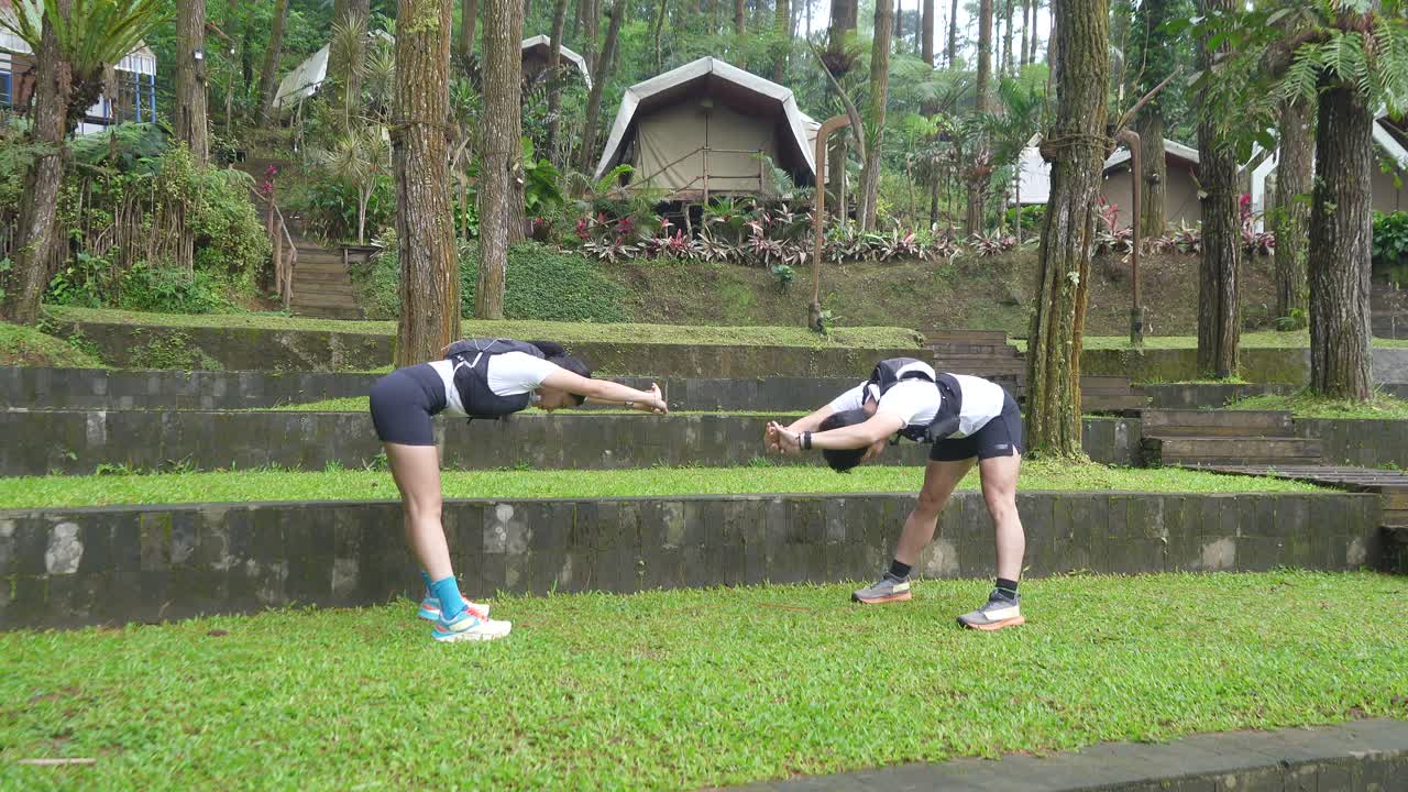 Runners Stretching Outdoors in a Campground