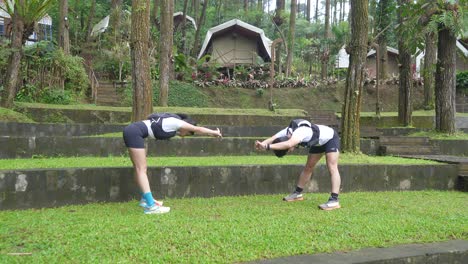 runners stretching outdoors in a campground