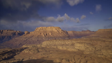 beautiful desert landscape in the mountains during sunset with dramatic clouds