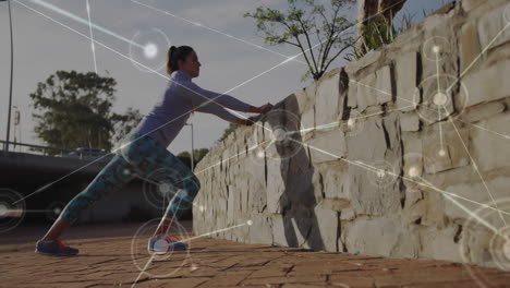 estirándose contra una pared de piedra, mujer haciendo ejercicio con conexiones de red animación