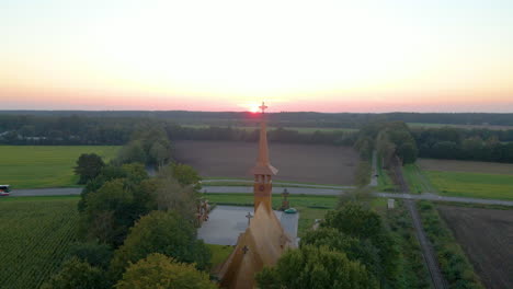 long spire of the beautiful church at dusk  in sogel, lower saxony, germany. aerial