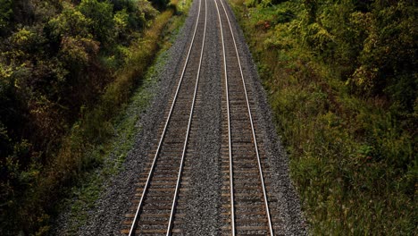 4k time lapse loop, long exposure of fast passenger train during rush hour. 2 way railroad transportation into and out of city. fast motion blur