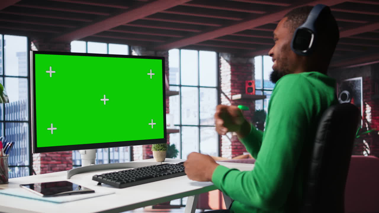 Young adult at home office analyzing data charts on mockup computer