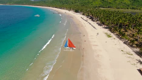 Sailing-boat-at-beach,-drone-shot