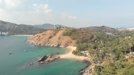 Wide-Panorama-of-Ya-Nui-Beach-enclosed-between-Promthep-Cape-and-Windmill-Viewpoint,-in-Phuket-Thailand---Aerial-wide-panoramic-shot