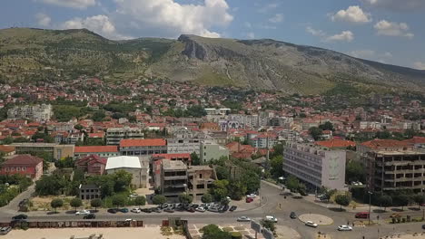 Beautiful-clear-aerial:-Mountains-overlook-Bosnian-city-of-Mostar