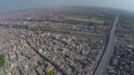 Aerial-view-over-the-City-traffic-road-junction-and-canal,-bridge-highway