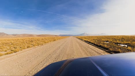 driving along the historic pony express trail in the west desert of utah in winter - driver point of view