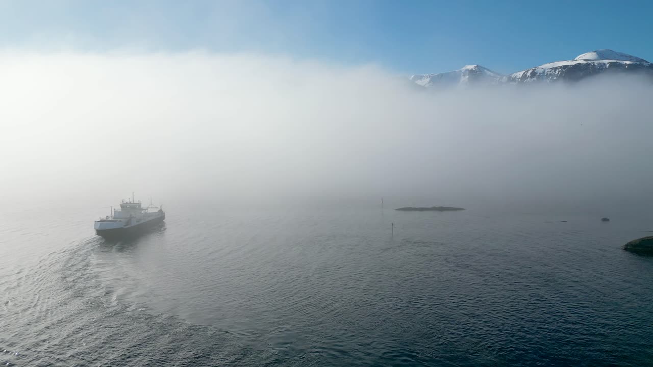 The car ferry MF &amp;quot;Haram&amp;quot; sails into thick fog between Dryna and Brattv&aring;g, just north of &Aring;lesund, Norway