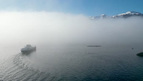 the car ferry mf &quot;haram&quot; sails into thick fog between dryna and brattvåg, just north of ålesund, norway