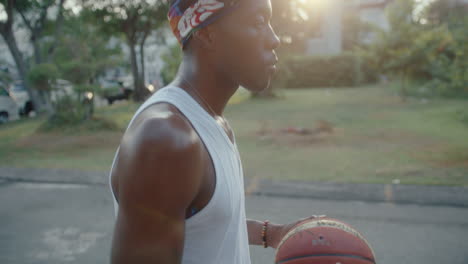 sweaty basketball player having rest after outdoor training