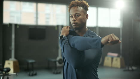 man stretching in gym