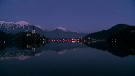 A-small-church-on-an-island-at-dawn-at-Lake-Bled-Slovenia-5