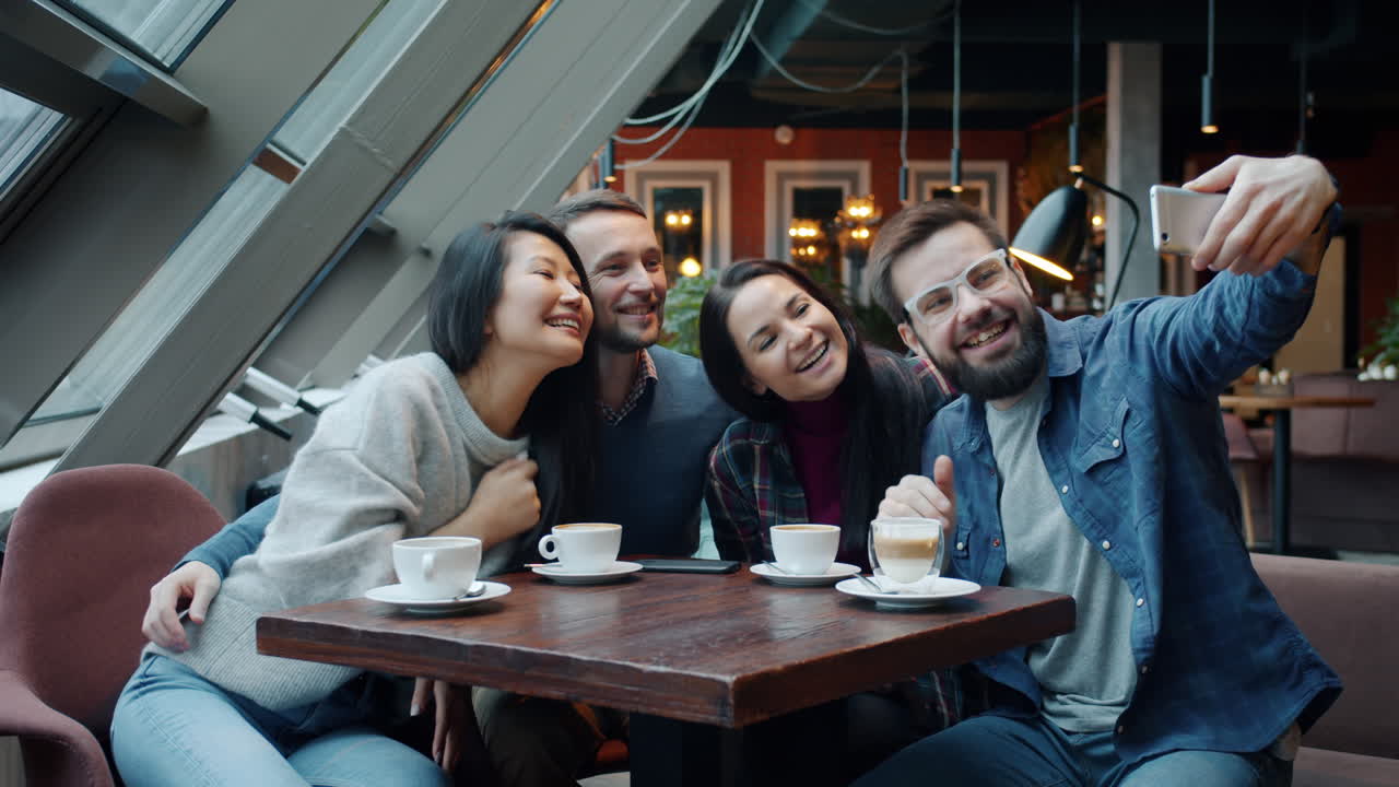 Friends Taking a Selfie in a Cafe