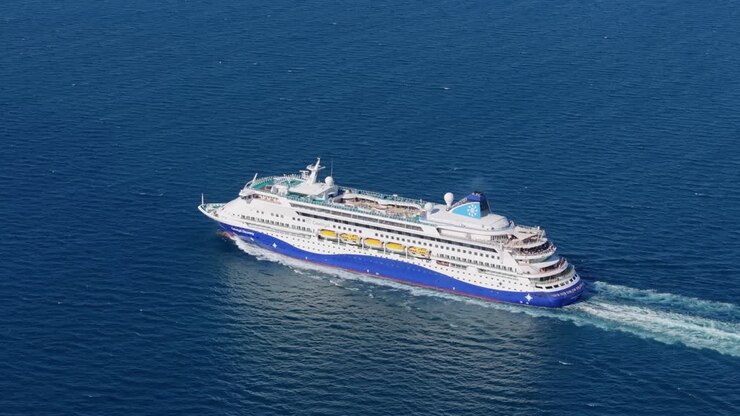 Luxury liner setting off from Kusadasi across Aegean waters, Turkey