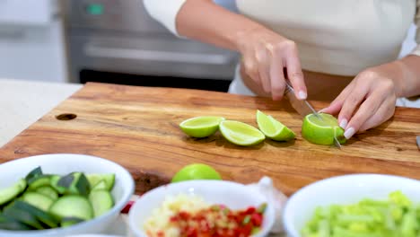 woman chopping lime for a dish