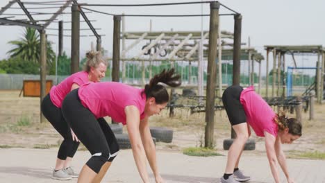 female friends enjoying exercising at boot camp together