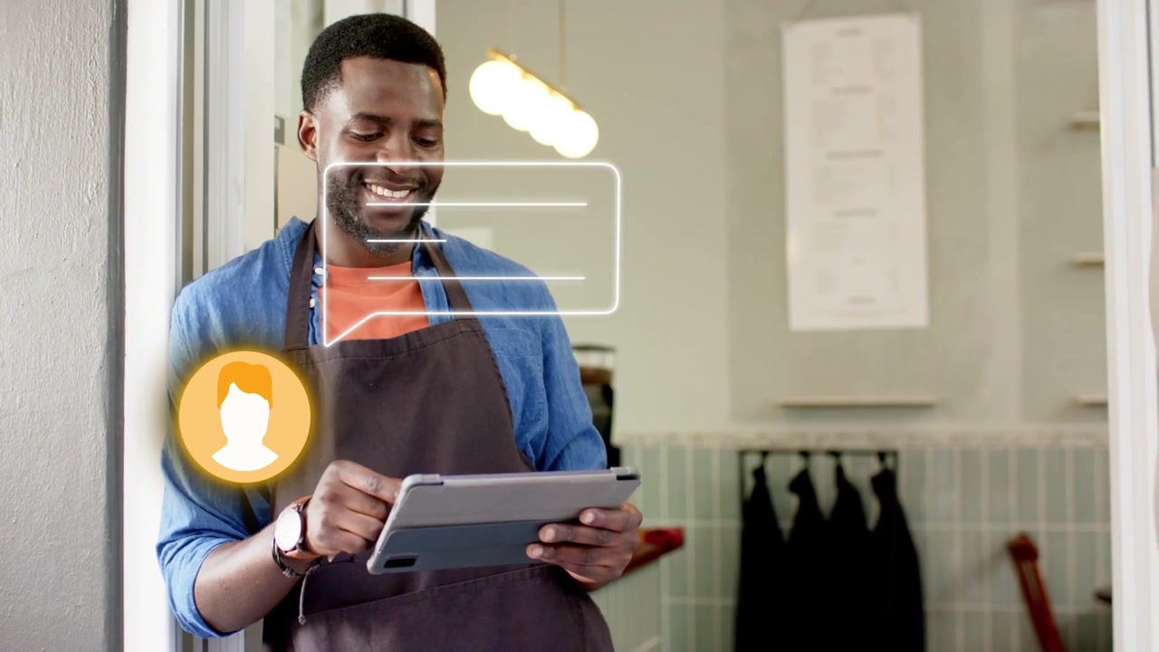 Vertical video: Tapping shop worker in apron checking chat bubble appearing on tablet in doorway