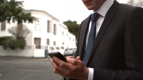 Handsome-businessman-having-a-phone-call