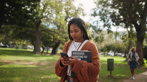 students in the park with a book