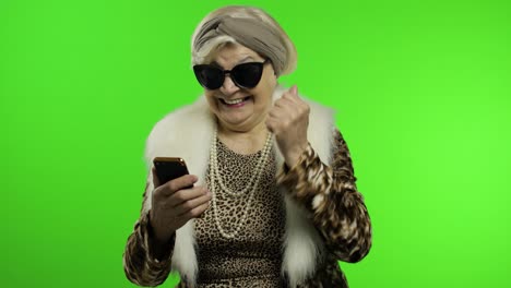 Elderly-stylish-trendy-caucasian-grandmother-woman-using-smartphone.-Chroma-key