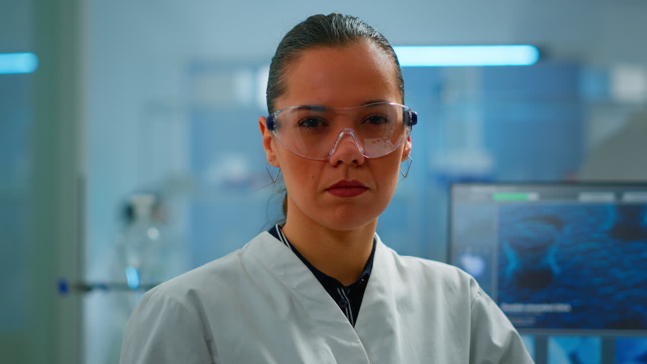 Tired chemist doctor looking at camera sighing