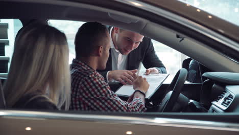 happy couple buying a car