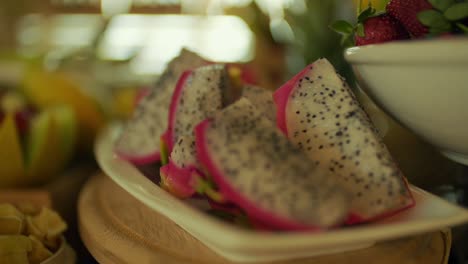 plate full of dragon fruit and strawberry image