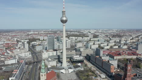 AERIAL:-Wide-View-of-Empty-Berlin,-Germany-Alexanderplatz-TV-Tower-with-No-People-or-Cars-on-Beautiful-Sunny-Day-During-COVID-19-Coronavirus-Pandemic-March-2020