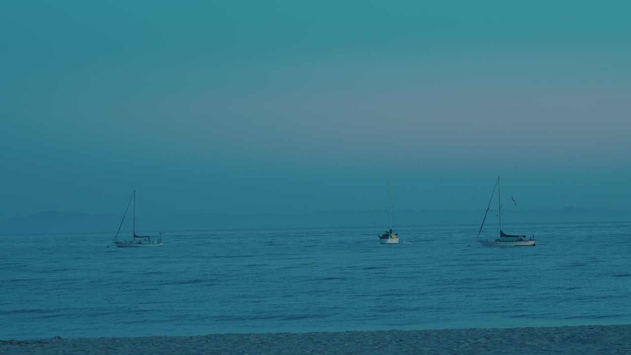 Dusk Over Waters in Santa Barbara, California as Yachts Drift in a Gentle Journey. USA