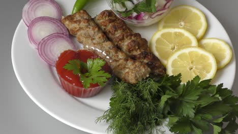 lula-kebab with fresh herbs and sauce