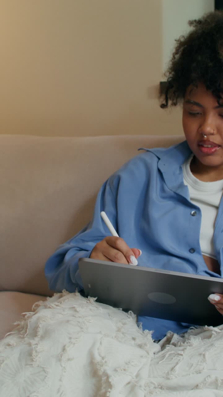 Woman using digital drawing tablet