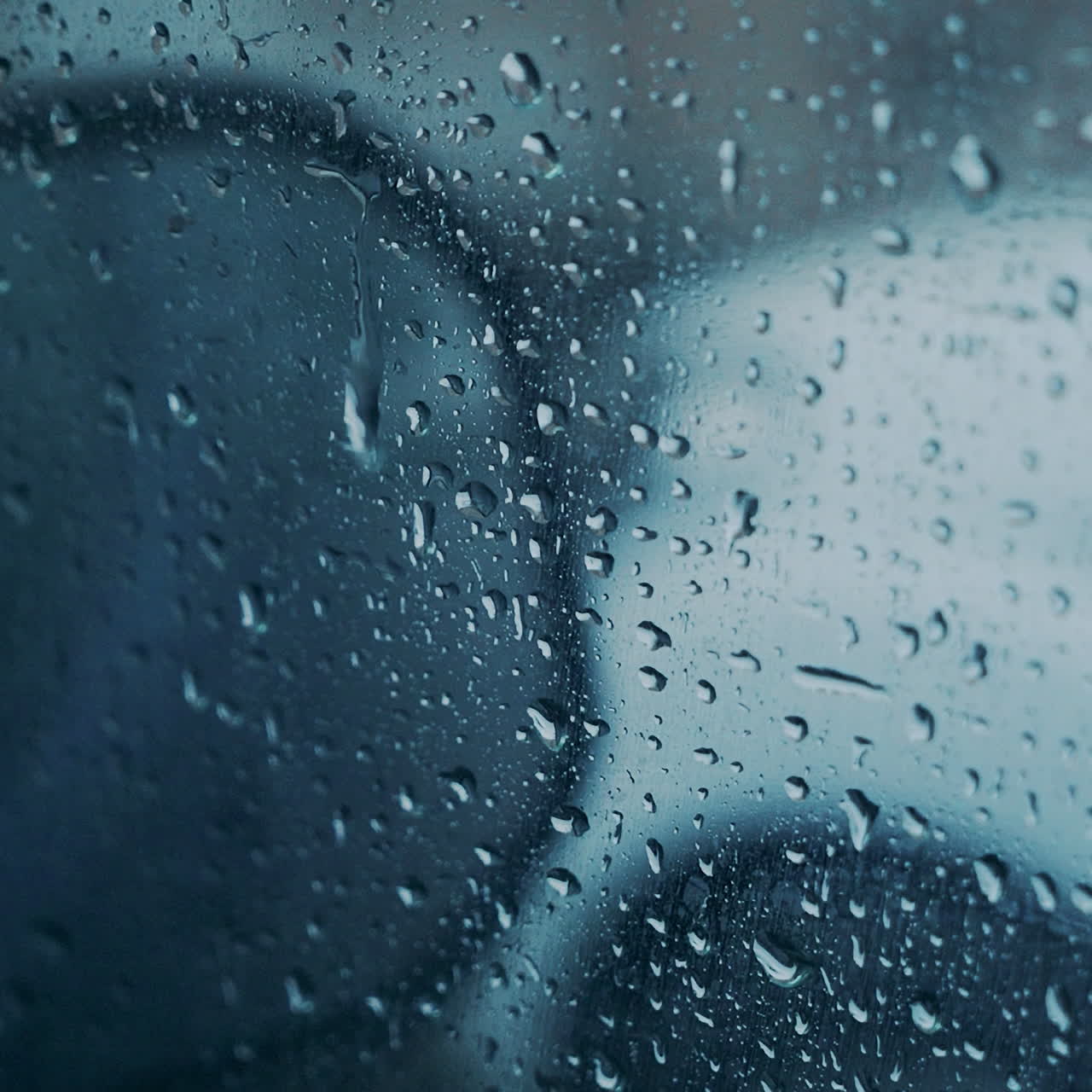Windscreen at the time of the rain. Mirror of car