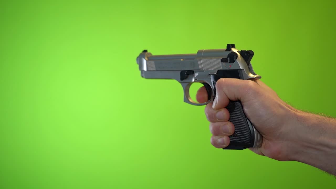 Pistol gun trigger firing recoil on green screen