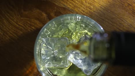 whisky poured over ice cubes. view from above