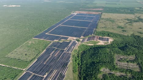 vast exotic countryside panorama with big photovoltaic power plant, aerial