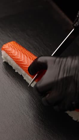 chef preparing salmon sushi