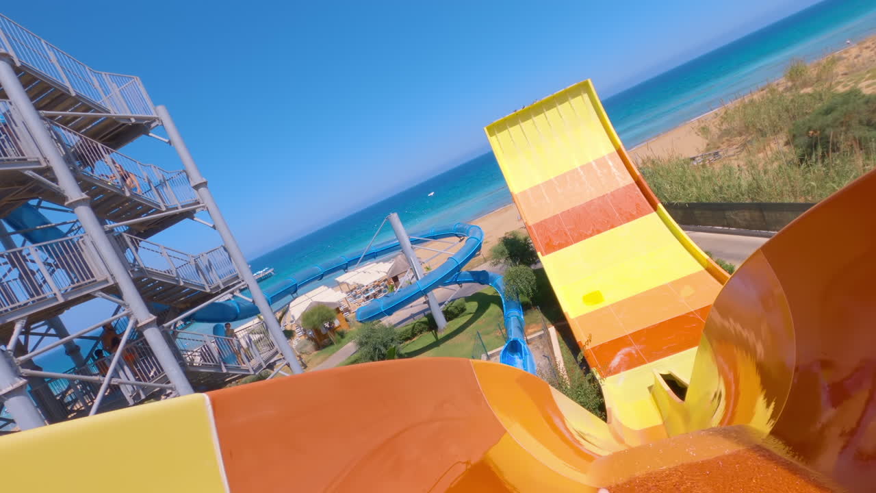 Woman sliding down a ride at a water park