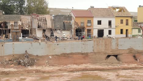 aftermath of devastating flood: damaged houses and emergency response