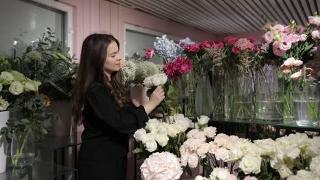 A Woman Expertly Arranges an Exquisite Array of Beautiful Flowers in a Chic and Stylish Flower Shop a Woman Expertly Arranges an Exquisite Array of Beautiful Flowers in a Chic and Stylish Flower Shop Environment