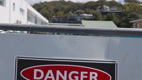 danger sign and construction site at beach