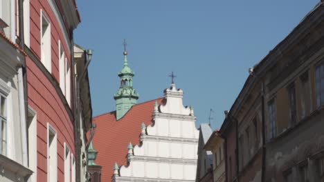 slow motion pan shot of typical polish buildings and a church