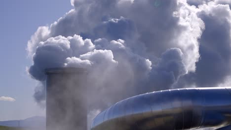 carbon emissions to the atmosphere from industrial pipes, industrial steam in the air