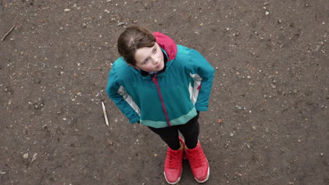 A-pensive-girl-looking-up-at-the-sky-and-closing-her-eyes