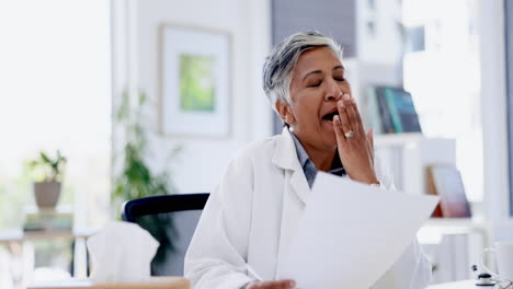 yawn, tired and senior doctor with documents