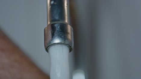 beautiful macro of water tap being turned on and off