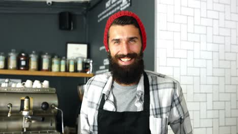 Portrait-of-waiter-standing-with-open-sign-board