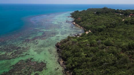 Aerial-view-of-Karimunjawa-Island-and-it-turquoise-sea-water-with-coral-reef---Central-Java,-Indonesia